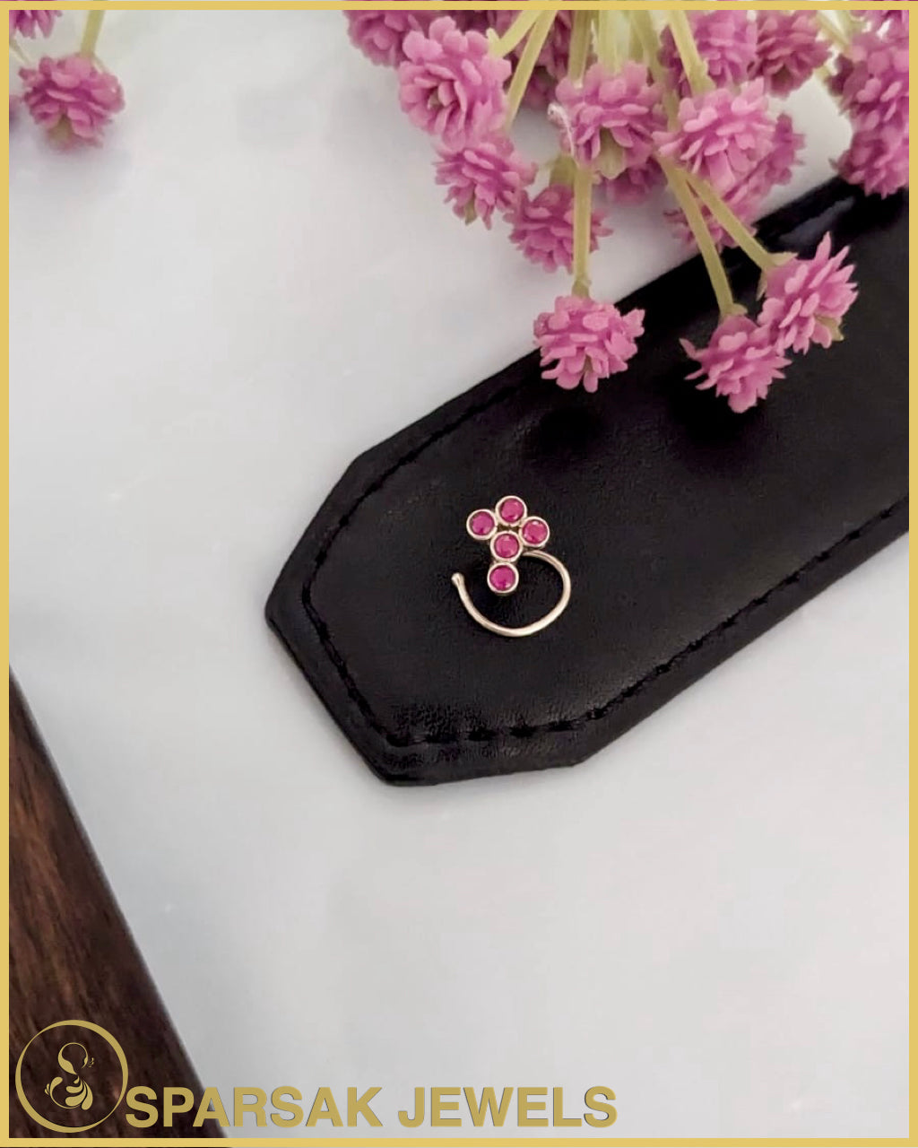 Graceful silver temple nosepin with filigree work on marble background