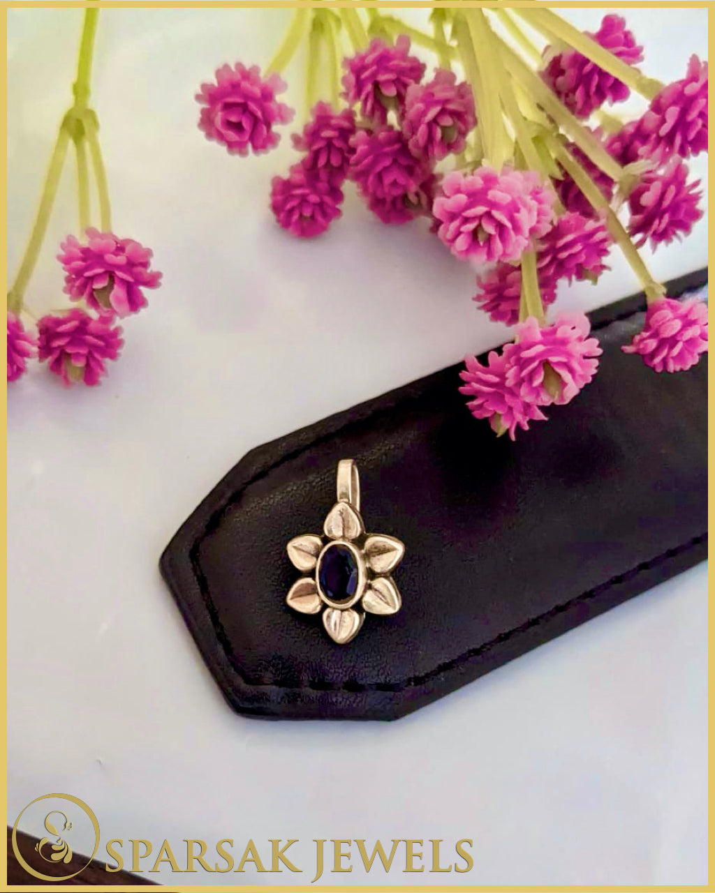 Intricately designed silver temple nosepin with floral motifs on black background