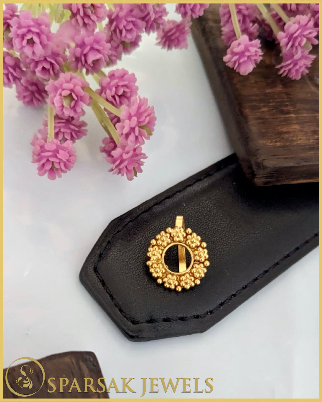 Silver temple nosepin with detailed engraving on black background