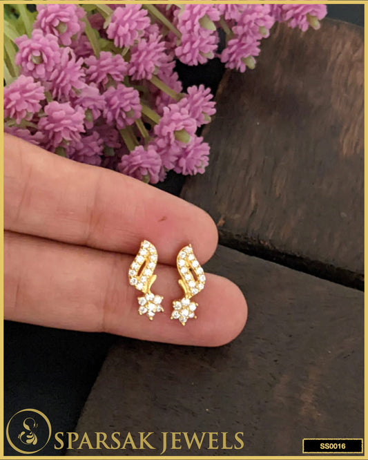 Gold-polished small silver stud earrings with delicate design on white background.