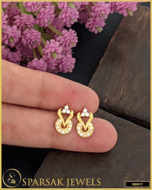 Gold-polished silver stud earrings with timeless design on white background.