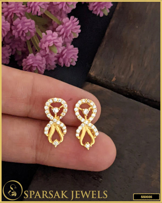 Gold-polished silver stud earrings with timeless design on white background.